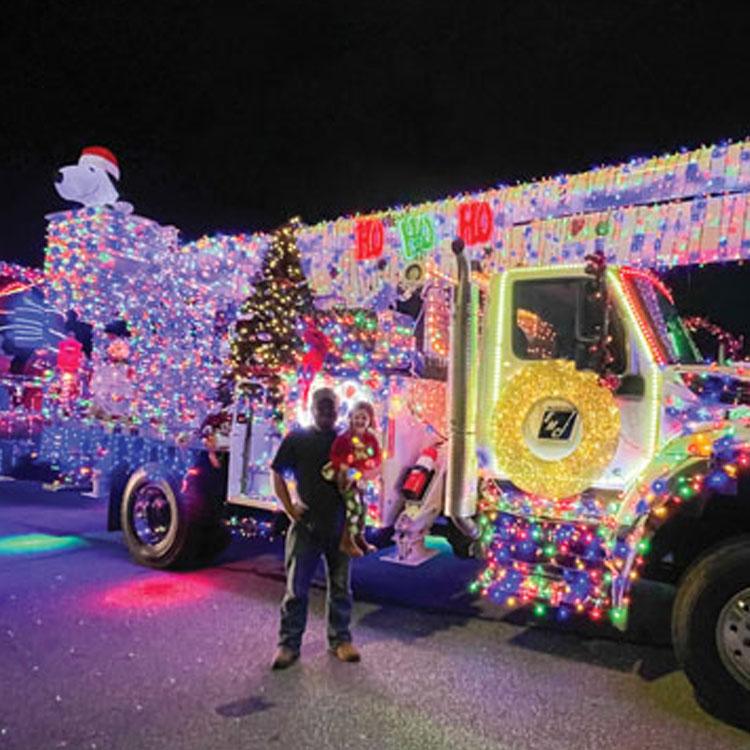 Habersham EMC showcases a lighted bucket truck in community Christmas parade