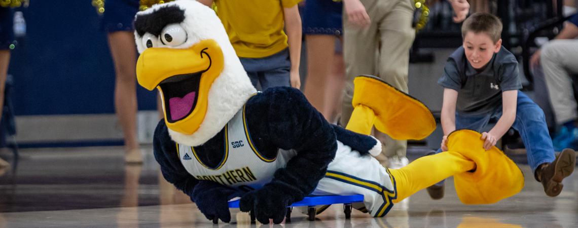Georgia Southern University's mascot, GUS, has some fun with fans at a game