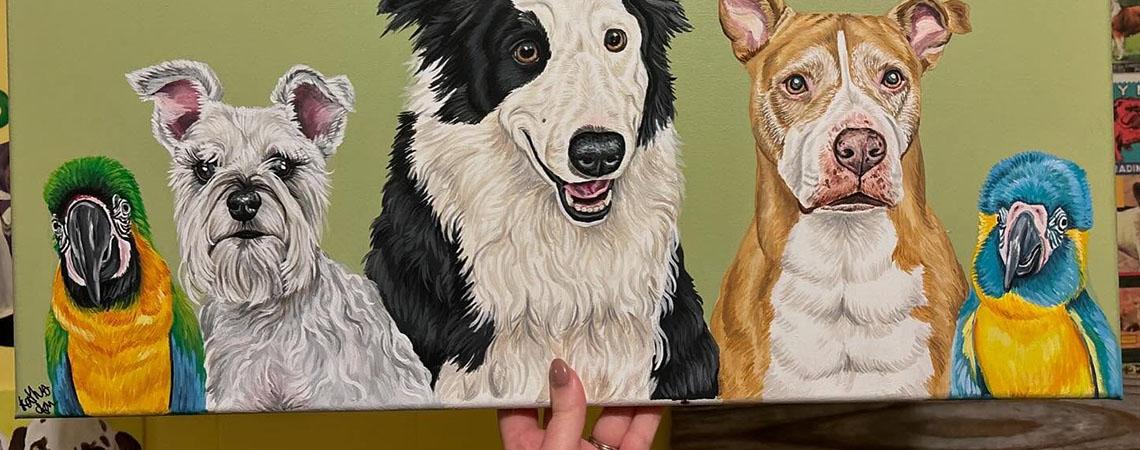artist hold pet portrait